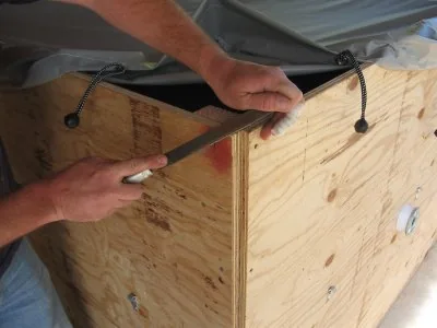 Filing the exposed end of the support