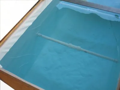 Water in the lined wooden tank
