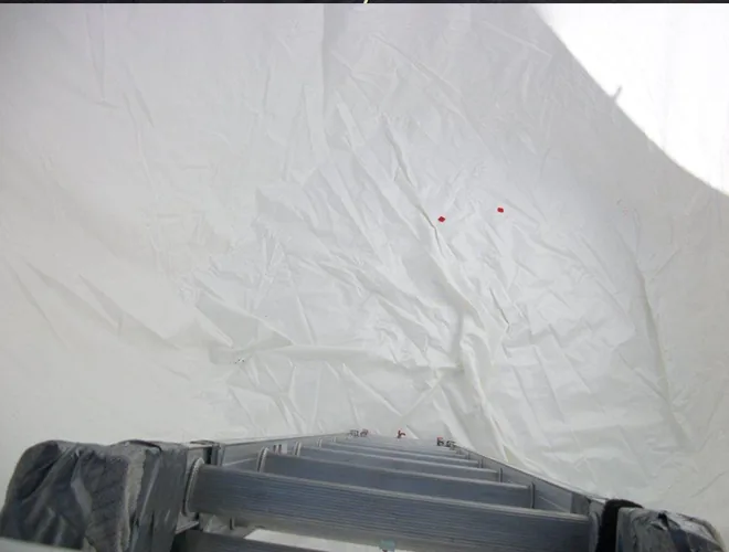 White liner unfolded inside the tank