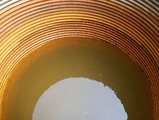 Water remaining in the unlined metal tank