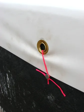 Grommet securing a hydroponic tank liner to a tank wall