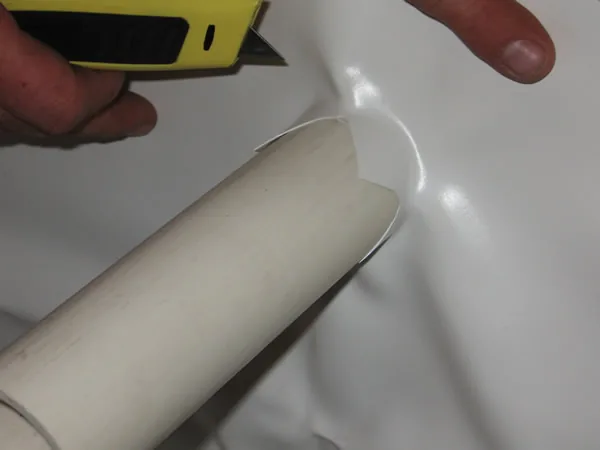 Pushing the pipe through the liner
