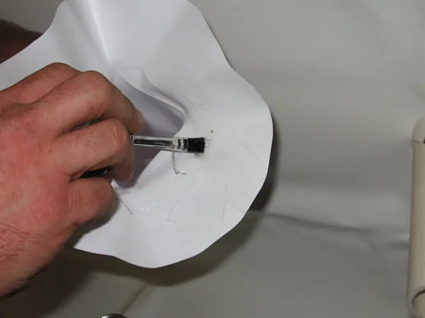 Gluing the brim of the witch's hat