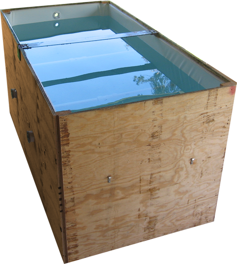 Filled rectangular wooden tank with a light-colored liner and wall fittings